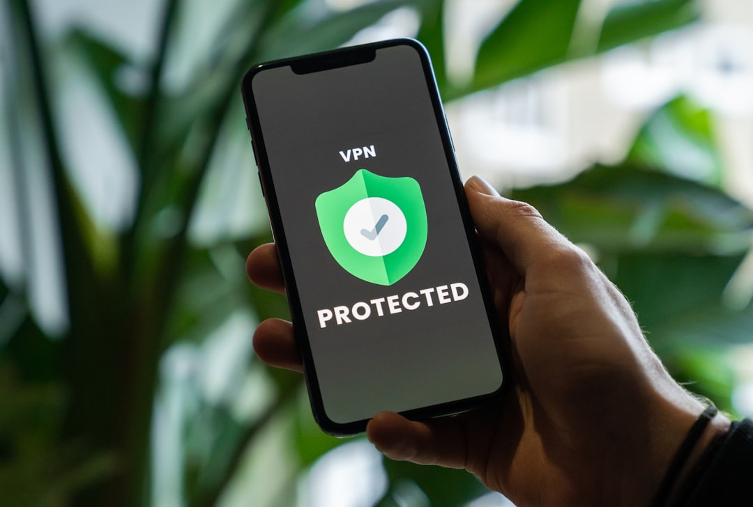 how to use blocked websites with vpn — person holding black iphone 5