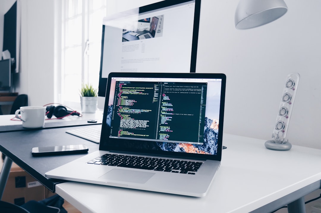 how to setup proxy with vite — A MacBook with lines of code on its screen on a busy desk